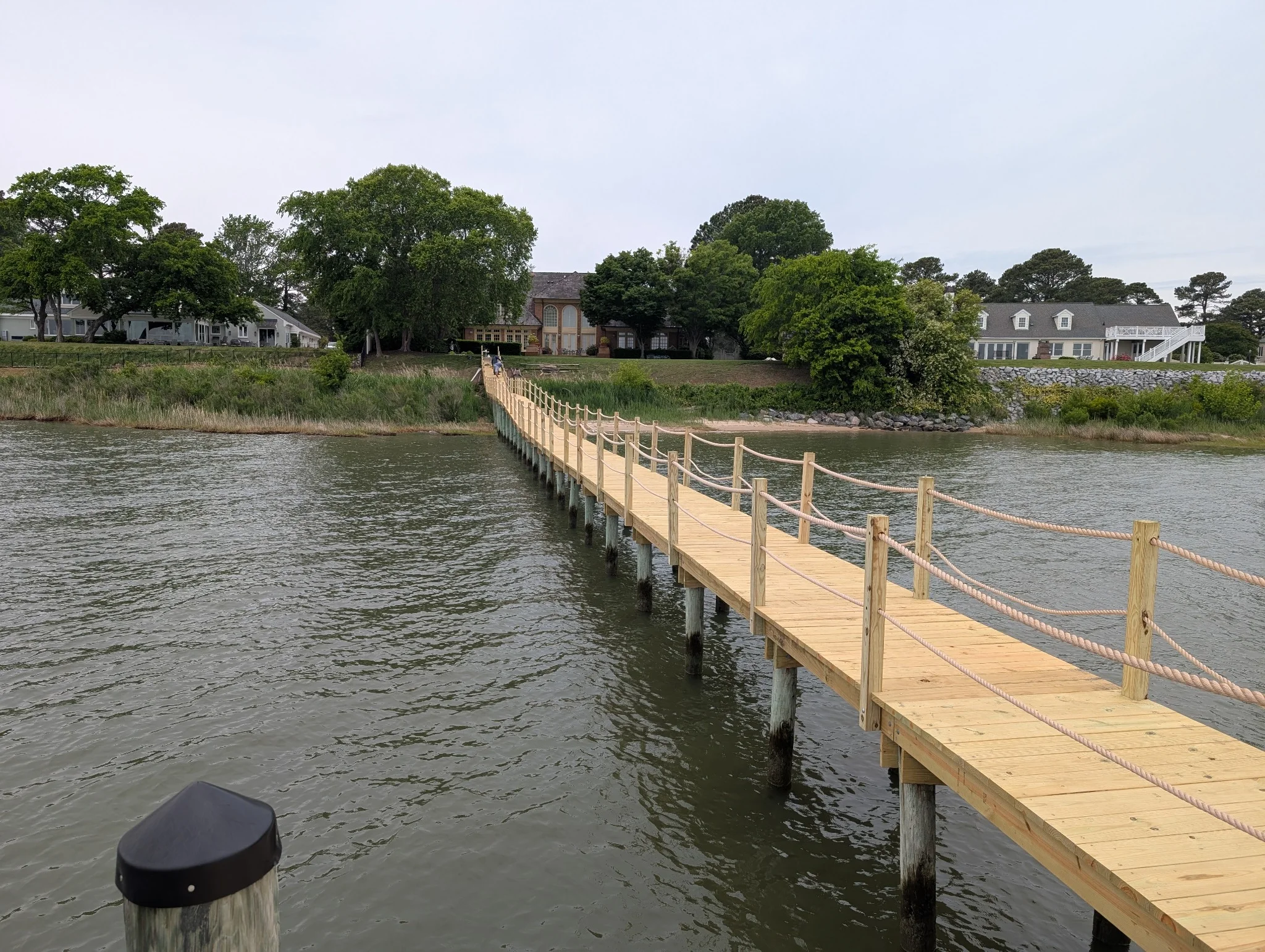 Newly re-decked residential pier with rope railing in Hampton Roads